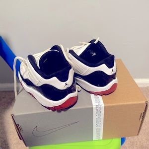 Patent leather black and white w/ touches of red Low Jordan